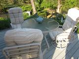 Patio set, many pieces kept in a gazebo.