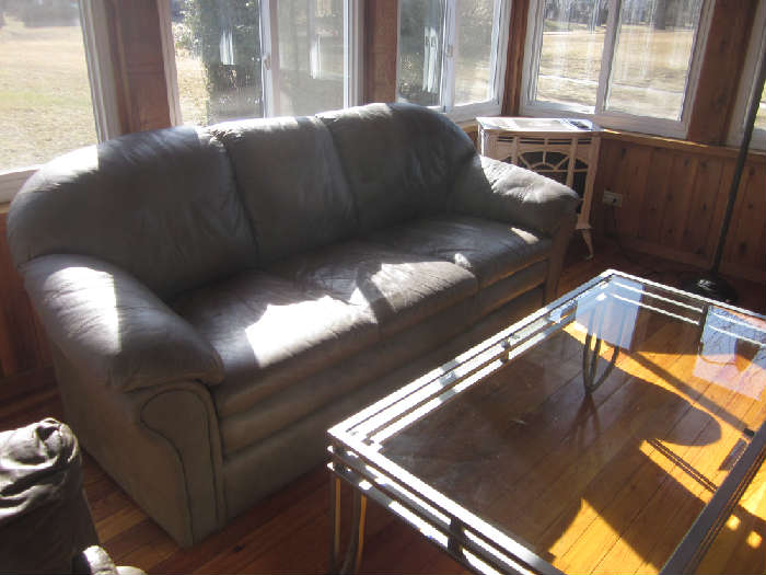 Tan leather sofa, glass and metal coffee  table, matching end table