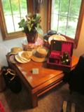 Coffee and end tables, ladies hats and accessories.