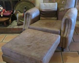 Gray leather chair and ottoman