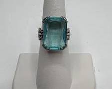 Ornate Sterling Silver Ring with Large Rectangular Light Blue Topaz. Total Weight 6.1 grams. Size 5.5