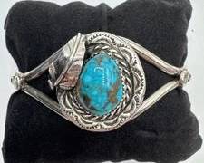 Native American Sterling Silver Cuff Bracelet With Turquoise Stone And Feather Motif. Total Weight 25.5 grams