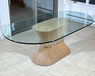 McGUIRE RATTAN & GLASS PEDESTAL DINING TABLE, ORGANIC MID CENTURY | Classic McGuire design with signature wheat sheaf pedestal base, in bound rattan, having an oval glass top
Dimensions: h. 28 x w. 43.5 x l. 77 in
