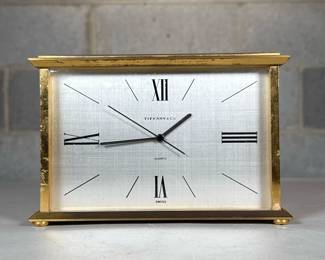 Tiffany & Co. Brass Desk Clock | Swiss made quartz clock with Roman numeral markers
Dimensions: h. 4.5 x w. 7 x d. 2.75 in
