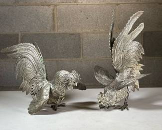 (2pc) Silver-Plated Fighting Roosters | A pair of intricately detailed rooster figures in dynamic fighting poses, each with finely textured plumage and expressive form
Dimensions: h. 11 x w. 7 x d. 5 in (Tallest)

