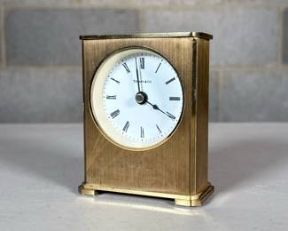 Tiffany & Co. Small Brass Desk Clock | With Roman numeral markers; quartz movement
Dimensions: h. 3.75 x w. 3 in
