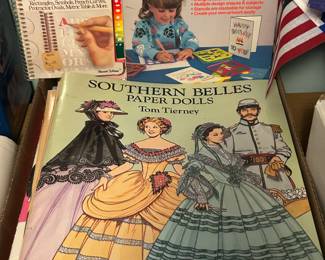 Several books of paper dolls