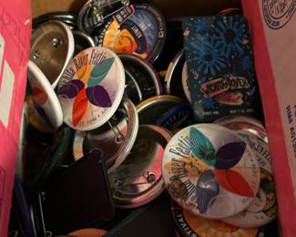 Two boxes of Riverfest buttons