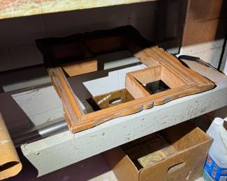 work area behind basement stairs.