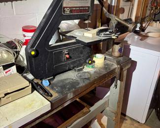 work area behind basement stairs.