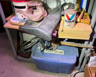 work area behind basement stairs.