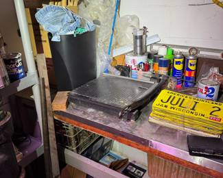 work area behind basement stairs.