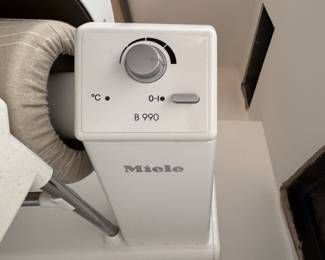 Miele Touchtronic B990 Rotary Iron with Wide Width Roller, 3 Temperature Settings, Variable Roller Speed and Fold Away Design. For Commercial and Residential Use. Measures Open: 39 1/2" W x 16 1/2" D x 37" H; Closed: 19 1/2" W x 16 1/2" D x 41 3/4" H. Photo 3 of 3.