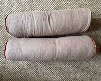 Pair of Oatmeal Cotton / Linen Bolsters with Orange Cord Trim. Photo 2 of 2.