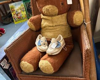 Vintage chair, teddy bear, and kids shoes