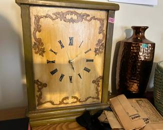 Vintage table clock and metal vase