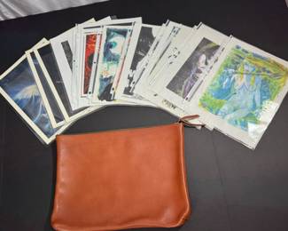 12 piece portfolio of artist signed sketches and art.