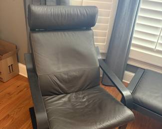 TWO LEATHER SIDE CHAIRS AND MATCHING OTTOMAN