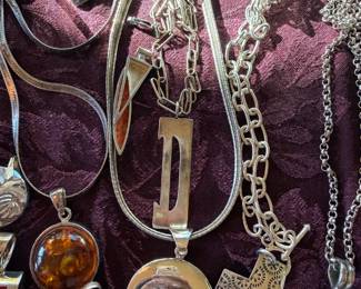Amber in sterling, carnelian and coral