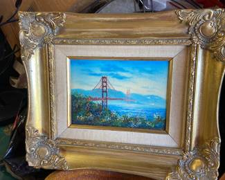 Vintage Golden Gate Bridge art in ornate frame