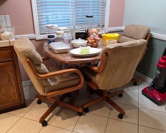 Vintage dining table with caster chairs