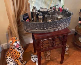 Just one of the occasional tables with bar items, including hand, blown glass stirrers