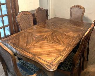 This is the dining table that would really bring some class to your dining room. Note also the two leaves, and the six matching chairs.