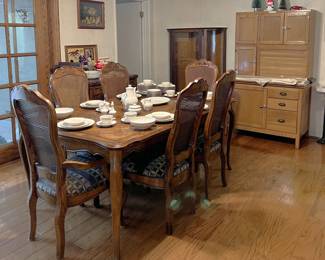 Here is another picture of the dining set, with a set of Franciscan china on it. You can also see a part of the lighted display cabinet and the storage unit.