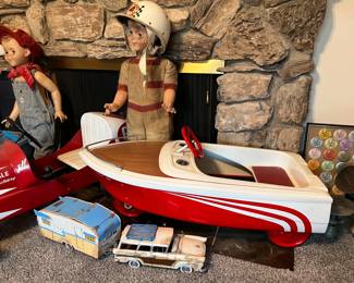 This is a better look at the pedal boat, and the station wagon and camper trailer (or "caravan", if you're British).