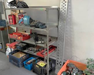 This is another shelf unit with miscellaneous power tools. There is a propane-powered Coleman lantern. The garage portion of the sale opens at 12 noon.