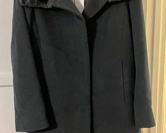 If you like coats, here is an excellent choice. The hanger says Saks Fifth Avenue. You'll need to come to the sale to see if the coat is from there.