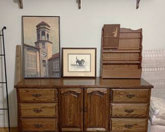 On the left side, you can see another look at a portion of the quilt rack, but the main item here is the dresser. If you like the artwork, then consider buying them.