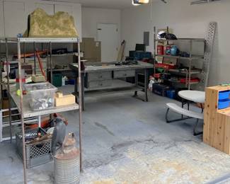 This is a decent overall picture of the garage, including a look at the child-sized storage and table. You can also ask about the shelving.