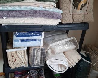 Luxury bath mats and rugs. Many new with tags.
Set of 4 Rooster chair cushions.