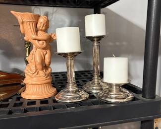 Set of three Restoration Hardware candleholders.