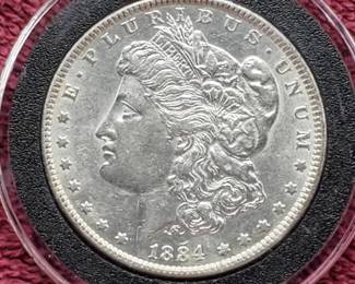 1884 Morgan Silver Dollar in Airtite, Higher Grade