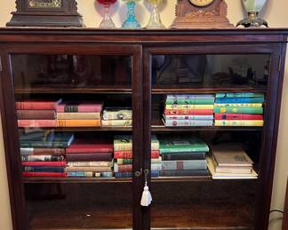 Walnut Or Mahogany Antique Double Door Bookcase, mantles clocks and Oil Lamps