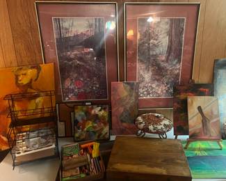 Variety of artwork, both by the owner and other artists as well as some art supplies. 