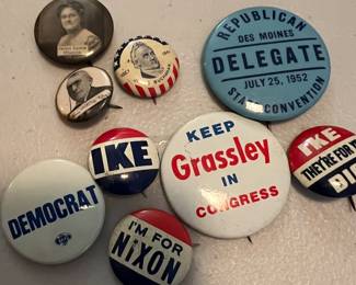 assortement of vintage pin backs, some political