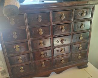 Vintage or antique Oriental apothecary or medicine cabinet