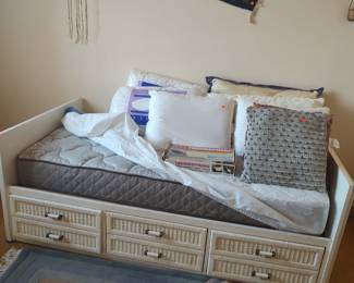 Twin bed, lots of pillows