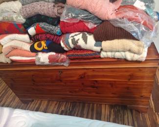 Beautiful vintage cedar chest overflowing with sweaters