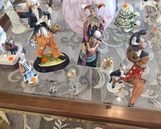 Fun collection of clown figurines, including one by Royal Doulton