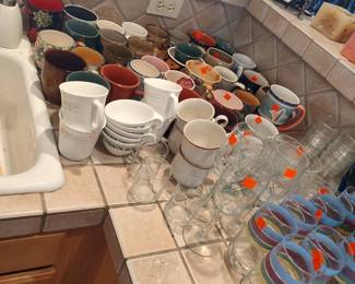 Kitchen is loadedwith mugs, glassware, and dishes