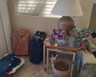 Glass top table, lamp, suitcases