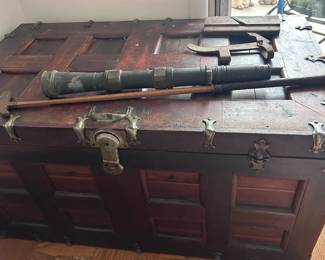 Closed antique Cedar chest, antique telescope and golf club