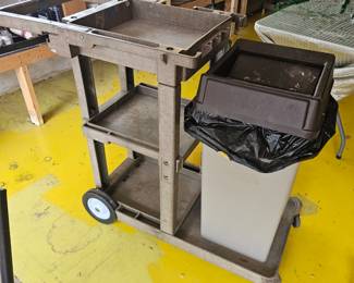 Deluxe janitors rolling trash cart with shelves and trash can,
$175