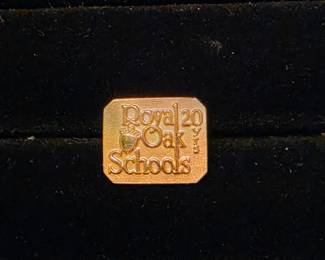 Gold pin from Royal Oak school