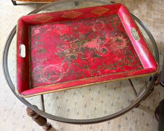 Round iron and glass table.  Oversize tole tray