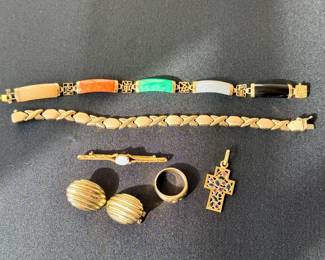 Gold jewelry, including bracelets, earrings, and small items